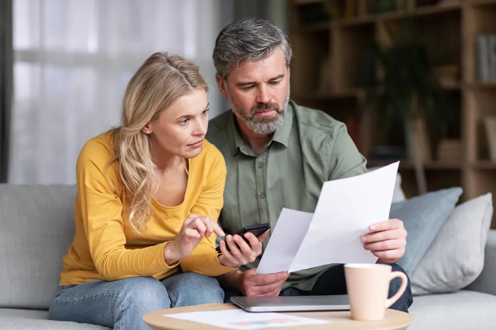 A couple going through bills at home