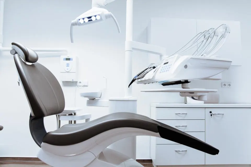 An empty dental chair in a clinic