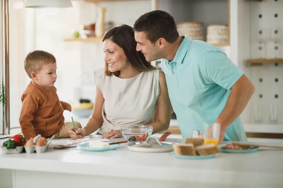 A family preparing food together in the kitchen