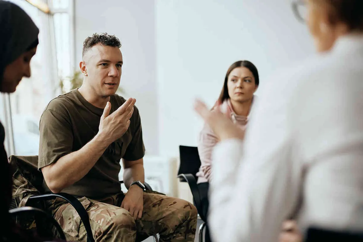 A man talking in a group session
