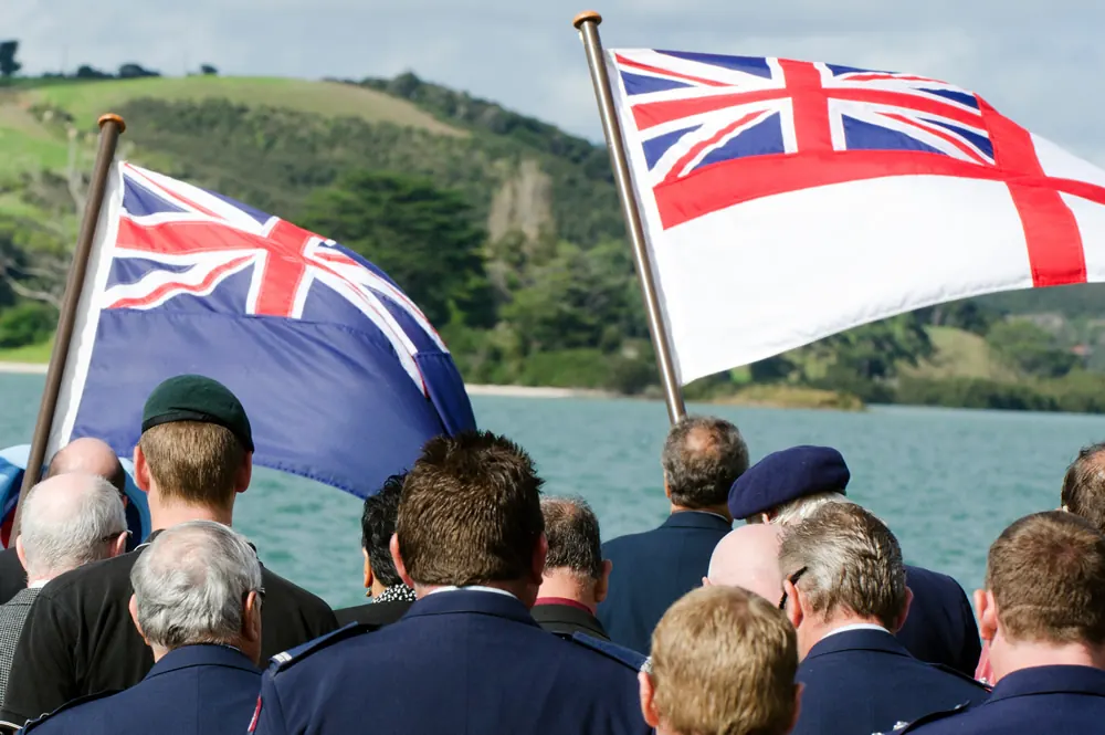 Veterans gathered on the water under the Australian flag and the naval ensign