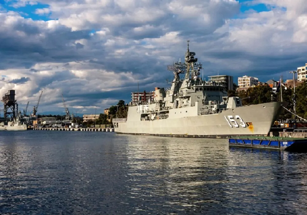 A navy ship moored in a harbour