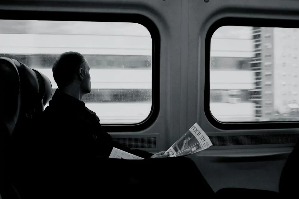 A passenger looking out of a train window