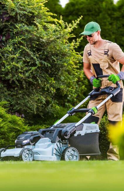AusVeterans contractor mowing a lawn as part of DVA lawn mowing services for veterans. Helping eligible veterans maintain safe, tidy outdoor spaces with professional gardening support.